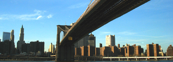 The Brooklyn Bridge spanning the East River into Manhattan.