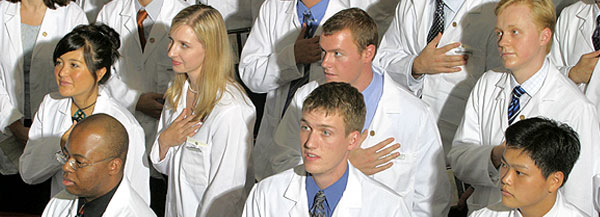 Graduating medical students take the Hippocratic Oath.