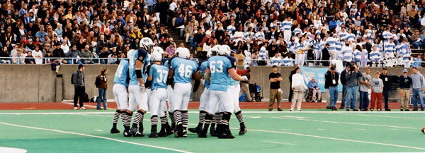 Columbia football players on the field during the 2003 homecoming game.