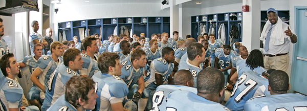 Norries Wilson gives pre-game instruction prior to his first game as Columbia's head football coach.