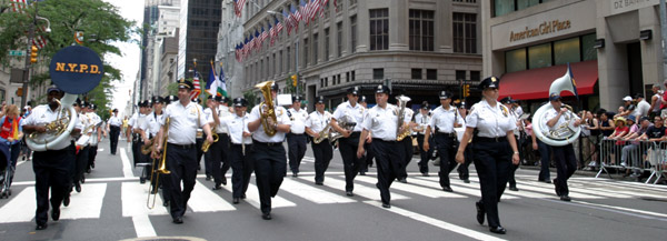 Members of the New York Police Department's marching band in the 35th Annual PRIDE march down Fifth Avenue.