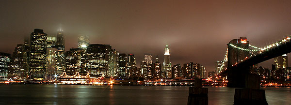 The skyline of lower Manhattan, as seen from the Brooklyn Piers on a foggy night.