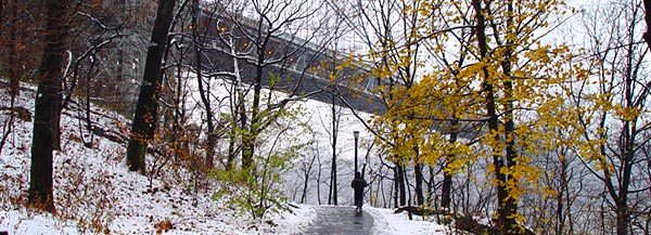 A jogger on the path under the George Washington Bridge near the Columbia University Medical Center.