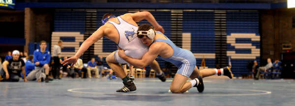 Wrestler Nick Sommerfeld takes down an opponent.