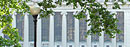 Butler Library seen through the trees near Low Library.