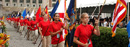 At Convocation, students display flags representing the nationalities of the student body.