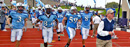 Head Coach Bob Shoop leads the Columbia Lions football team onto the field.