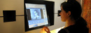 A student explores a multimedia kiosk built by Columbia University for the Malcolm X and Dr. Betty Shabazz Memorial and Educational Center.