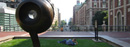 A student reads on Revson Plaza, which connects the campus over Amsterdam Avenue.