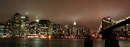 The skyline of lower Manhattan, as seen from the Brooklyn Piers on a foggy night.