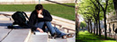 A student sits on Low steps and reads.